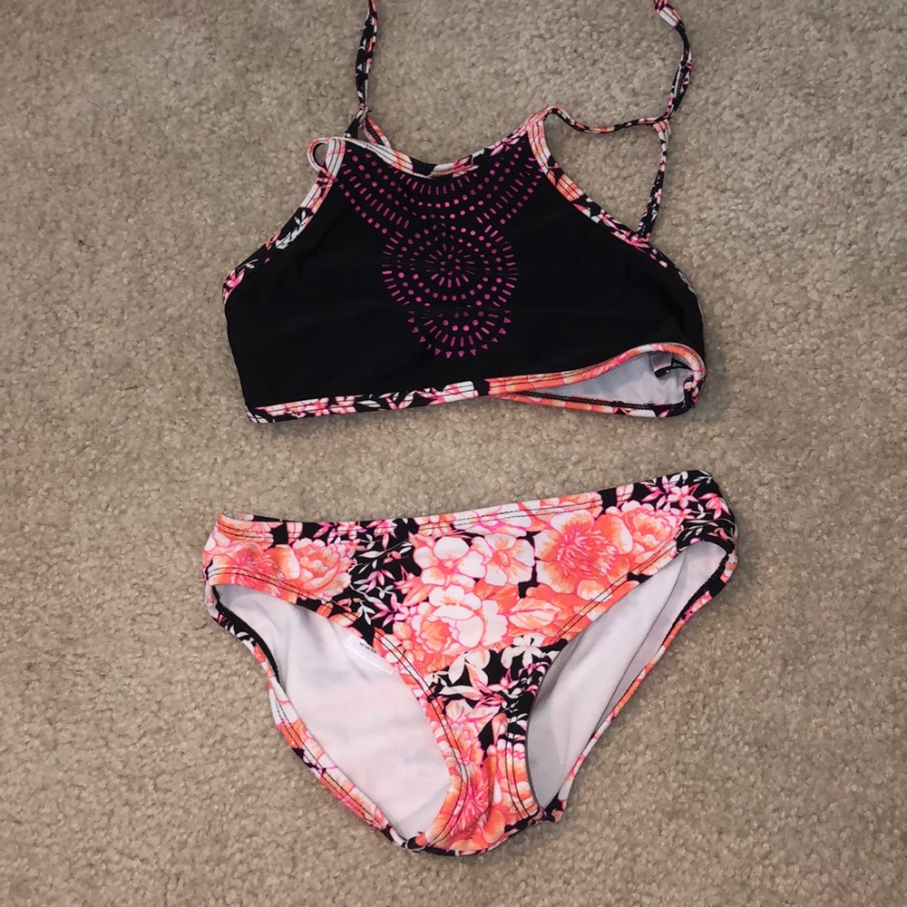 A black and floral bathing suit set